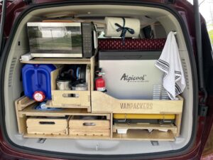 This is the kitchen unit with my Alpicool refrigerator, Microwave, pots and pans, and 2 pull out wooden half crates.